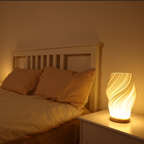 Tischleuchte mit Wellendesign und LED-Licht -    Zorenza