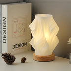 Tischleuchte mit Wellendesign und LED-Licht -    Zorenza