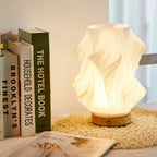 Tischleuchte mit Wellendesign und LED-Licht -    Zorenza