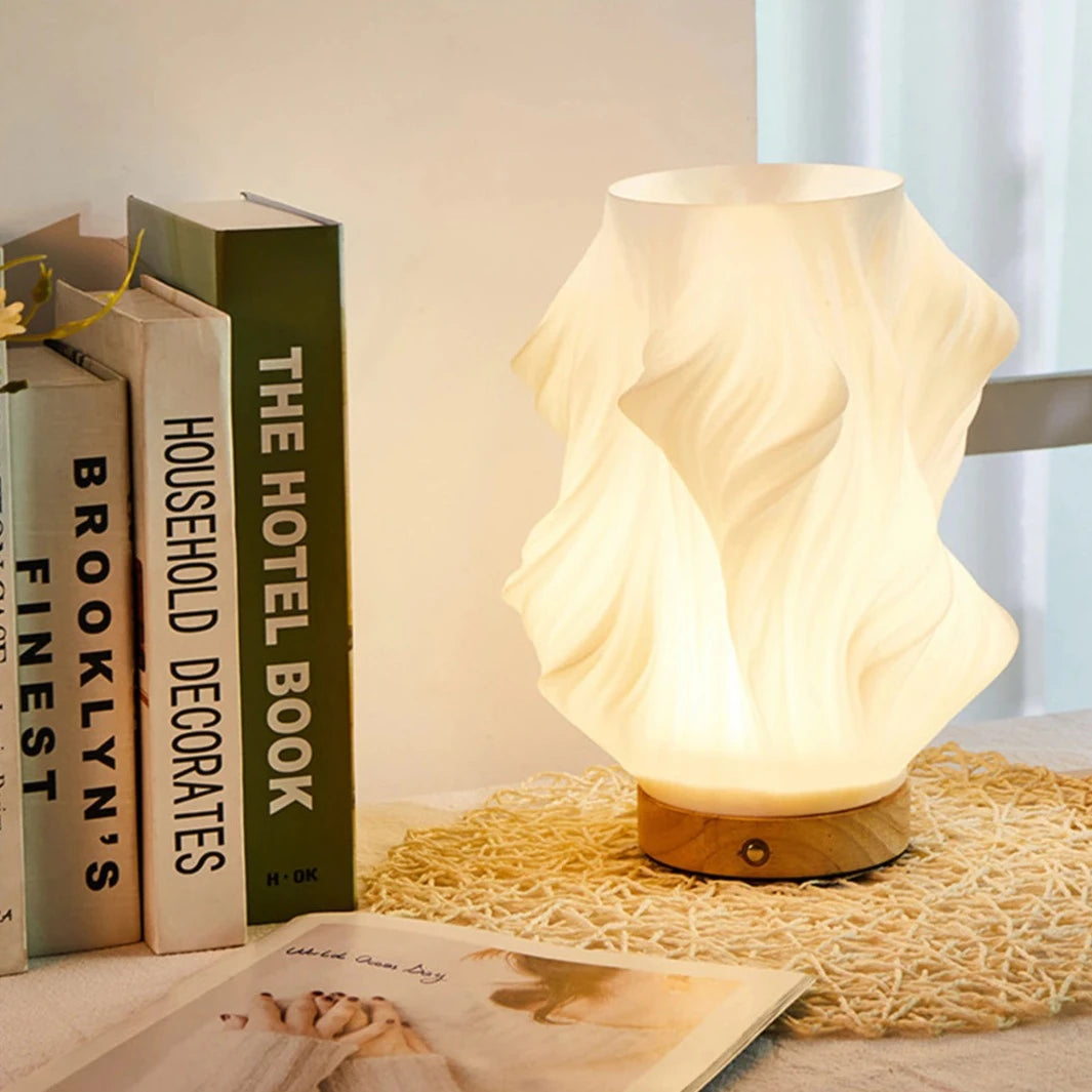 Tischleuchte mit Wellendesign und LED-Licht -    Zorenza