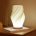 Tischleuchte mit Wellendesign und LED-Licht -    Zorenza
