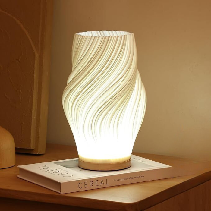 Tischleuchte mit Wellendesign und LED-Licht -    Zorenza