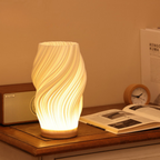 Tischleuchte mit Wellendesign und LED-Licht -    Zorenza