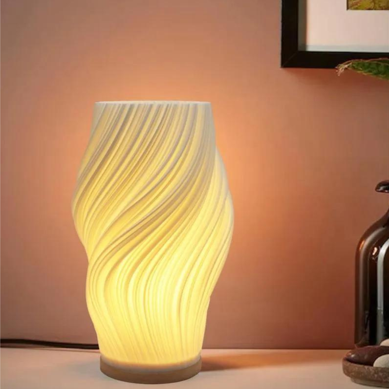 Tischleuchte mit Wellendesign und LED-Licht -    Zorenza