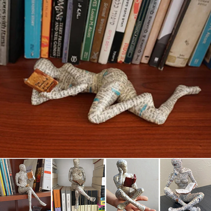 Lesende Figur aus Kunstharz mit Zeitungsdruck-Optik Zorenza
